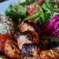 Chicken Kebab · Skewered, charbroiled cubes of seasoned chicken breast served with onion salad, grilled toma...