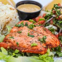 Grilled Salmon · Marinated, charbroiled salmon filet served with Shepherd's salad, and rice pilaf.