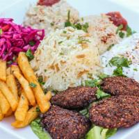 Falafel · Deep-fried chickpeas and traditional spices served with tzatziki sauce, sliced cucumbers, pi...