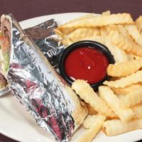 Gyro · Gyro meat topped with fresh sliced tomatoes, onion, and lettuce and served with French fries...