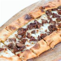 Protein Flatbread Pita · Flatbread pita with mozzarella cheese and your choice of gyro meat, beef or chicken.