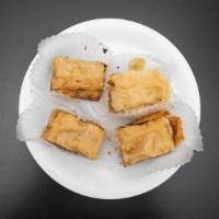 Baklava · Home-made sheets of phyllo dough with walnuts and a honey-based glaze.
