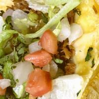 Brisket Tacos · Warm corn or flour tortilla with Smoked Brisket and your choice of toppings with beans and r...