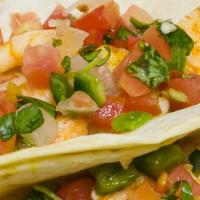 Shrimp Tacos · Warm flour tortilla filled with grilled shrimp, avocado spread and topped with pico.  Includ...