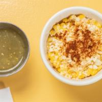 Mexican Corn · Corn mixed in a creamy mayo and lime base sauce, then topped with Cojita cheese and Chile po...