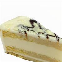 Tres Leches Cheesecake · Made with Vanilla sponge cake infused with three condensed milks.  It is topped with white c...