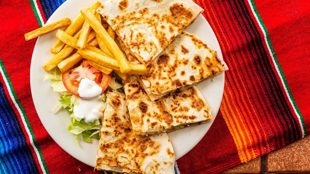 Quesadillas · Cheese and onions, tomato, bell pepper and choice of beef fajita or chicken. Served with fries and salad.