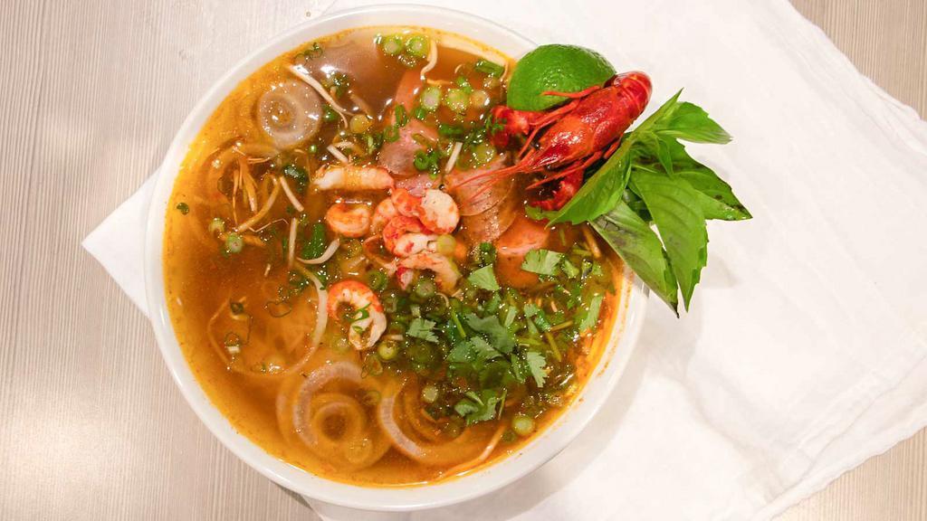 Crawfish Cajun Pho · Yep, our World Famous Crawfish Pho. Invented in the top secret LA Crawfish test kitchen years ago and featured in countless media outlet publications worldwide since then! It’ll literally change your life, or so we’ve been told so many times over!

It’s a Cajun infused broth with a dozen or so hand-peeled Crawfish tailmeat and sliced double smoked Andouille sausage accompanied by the traditional Vietnamese Pho accoutrements.