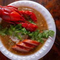Seafood Gumbo · Cooked from scratch in our kitchens. There's Shrimp, Crab Bits, Crawfish Tails & Andouille S...