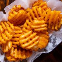 Seasoned Fries · Waffle cut seasoned potatoes fried to a golden crispy delight!