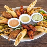 Chango Platter · Taquitos, Donkey wings, Tex-mex Eggrolls and Gorilla Peppers. No substitutions.