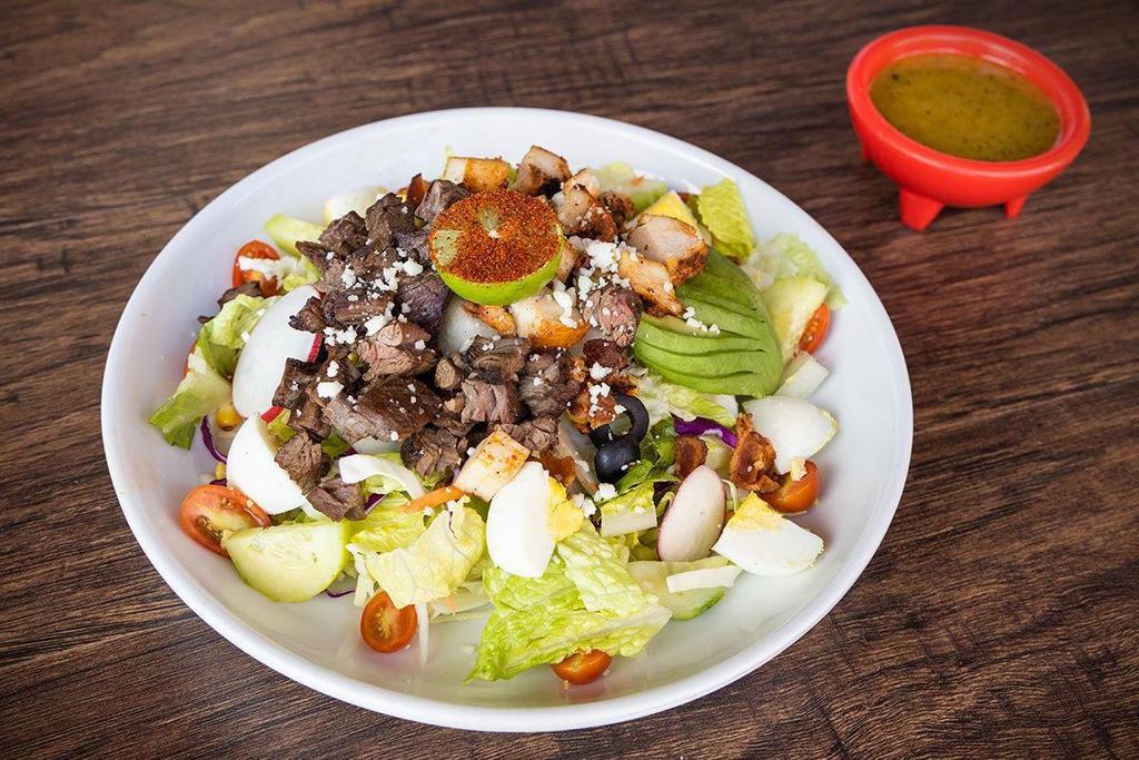 Machete Salad · Sliced, diced and tossed - fajita chicken, crispy bacon, tomatoes, boiled eggs, black olives, roasted corn, queso fresco, cucumbers and avocado.