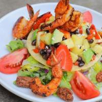 Shrimp Tostada Salad · Grilled shrimp, pineapple, avocado, mixed greens, pecans, black beans, red peppers, tomatoes...