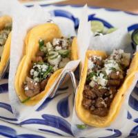 Ribeye Street Tacos · (3) Tacos; ribeye tips, onion, cilantro, soft corn tortillas - spicy red salsa & avocado sal...