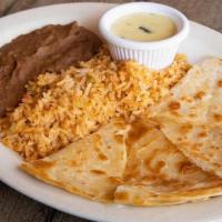 Kid'S Quesadillas · Flour tortilla filled with cheese and cut into four wedges - served copita of queso, Spanish...