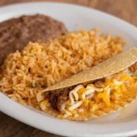 Kid'S Taco · Crispy taco filled beef picadillo and grated cheese. Served with Spanish rice & choice of be...