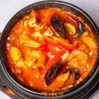#69. Soondubu Jjigae · Spicy. Spicy red chili stew with silky tofu (choice of vegetarian, beef, or seafood)