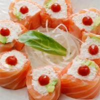 Butterfly Kiss Roll - Raw (No Rice) · Crabmeat, avocado wrapped with soy paper and salmon with ponzu sauce, sriracha on top