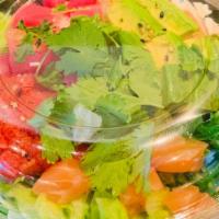 Combo Poke · Sushi rice, crabmeat, spicy tuna, seaweed salad, lettuce, cilantro, avocado, tuna, salmon