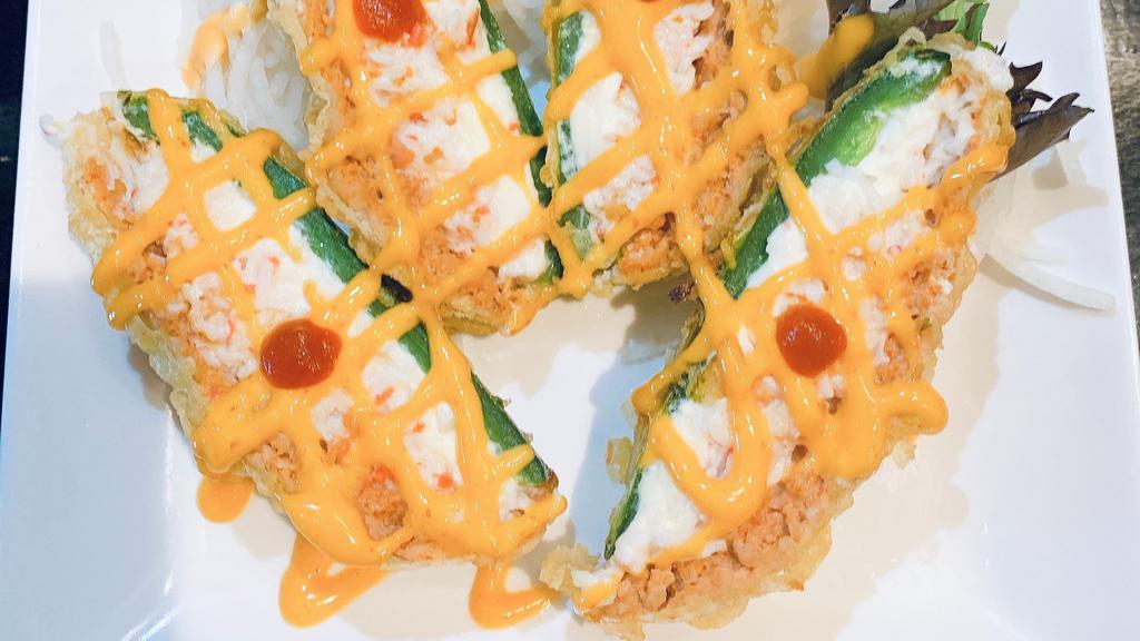 Heart Attack  · Lightly battered, jalapenos stuffed with creamcheese, crabmeat, spicy tuna top with eel sauce, spicy mayo