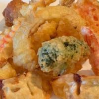 Tempura Combo (9Pc)  · Shrimp Tempura (2pc)
Veggie Tempura (3pc)
Chicken Gyoza (2pc)
Veggie Egg Roll (1pc)
Crabstic...