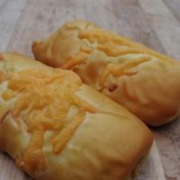 Large Sausage & Cheese Kolache · A smoked pork and beef link sausage wrapped up in cheese and a sweet bread.