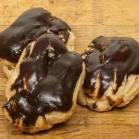 Eclairs · A pastry shell filled with Bavarian cream, topped with chocolate ganache.