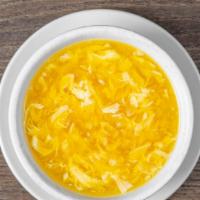 Egg Drop Soup · Velvety broth with egg and creamed corn.