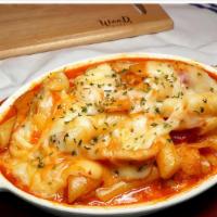 Cheese Tteok - Bokki · Rice cake in Korean spicy sauce with vegetable top on cheese.