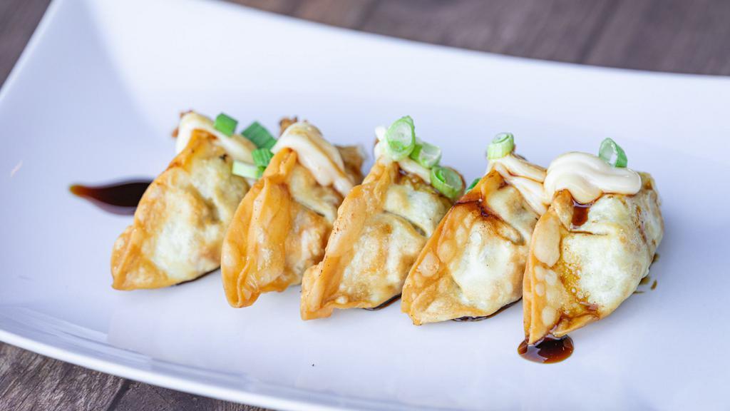 A3 Goyza (6) · Steamed or Crispy fried Chicken and vegetable dumplings. Drizzled with house mayonnaise and black sauce, topped with chopped green onion. Optional Sauce on the side