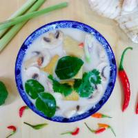 S2 Tom Kha Soup · Creamy spicy and sour Thai coconut lemongrass soup your choice of tofu, chicken or shrimp wi...