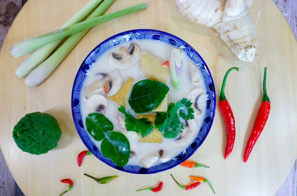 S2 Tom Kha Soup · Creamy spicy and sour Thai coconut lemongrass soup your choice of tofu, chicken or shrimp with galangal, mushrooms serve with jasmine rice.
