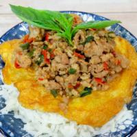 R1 Omelet Kra Pow · Our basil stir-fried is one of the most popular dish with 1 egg omelet. Your choice of groun...