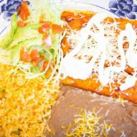 Enchilada Plate · Choice of meat, cheese potato and salad vegetable served with rice and beans.