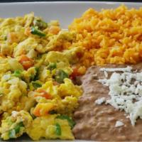 Huevos Mexicano · Vegetarian. Chopped tomato, green chili, pepper, and onion fried with eggs and served with r...