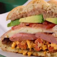 Torta Cubana · Vegetarian. Piece of ham with pork chorizo with American cheese, pickle, and salad rolled in...