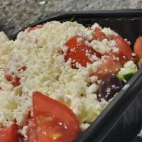 Greek Salad · Lettuce, onion, cucumber, tomato, feta cheese, and kalamata olives with homemade Greek vinai...