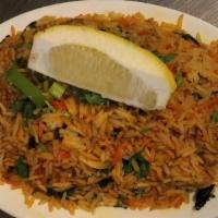 Chicken Biryani · Chunks of chicken kebabs sautéed with
basmati rice and a touch of curry sauce.