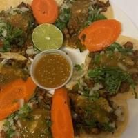 Tacos (Street Tacos) · Street taco style with onions, cilantro with your choice of meat. limes and salsas included.