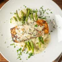 Grilled Salmon With Risotto · Grilled fillet of salmon topped garlic lemon pepper sauce,  served with parmesan risotto and...