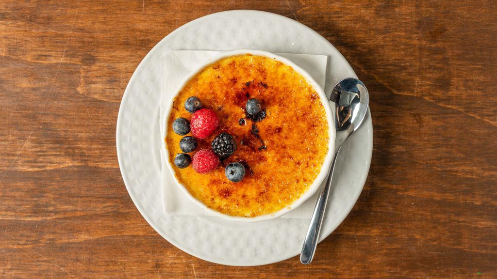 Crème Brûlée · Rich vanilla custard topped with a layer of hardened caramelized sugar.