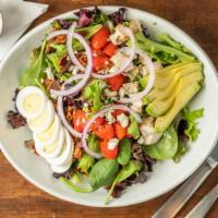 Cobb · Romaine lettuce topped with diced chicken, bacon, cherry tomatoes, red onion, blue cheese cr...