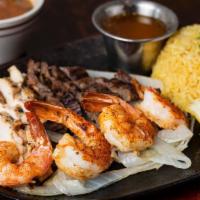 El Capitan · Four grilled shrimps and your choice of meat.