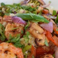 Baja Shrimp Bowl · Shrimp, tomatoes, onions, jalapeños, lime juice, asparagus, house fire sauce. Served over yo...