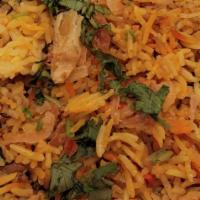 Chicken Biryani · Aged basmati rice cooked over chicken meat marinated in spices then richly flavored with saf...