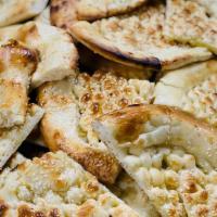 Tandoori Roti · Very popular flat whole wheat bread made in clay oven.