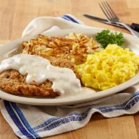 Chicken Fried Breakfast · Hand-battered steak or chicken topped with cream gravy, served with two eggs, your style.