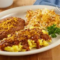 Chili & Eggs · Three eggs, your style, topped with frontier chili and cheddar cheese, served with refried b...
