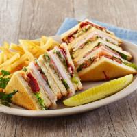 Clubhouse Sandwich · Triple-decker with sliced turkey, bacon, lettuce, tomato and mayonnaise on toasted country w...