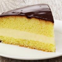 Boston Cream Pie · Moist yellow cake filled with a layer of vanilla cream, lightly covered with a delicious cho...